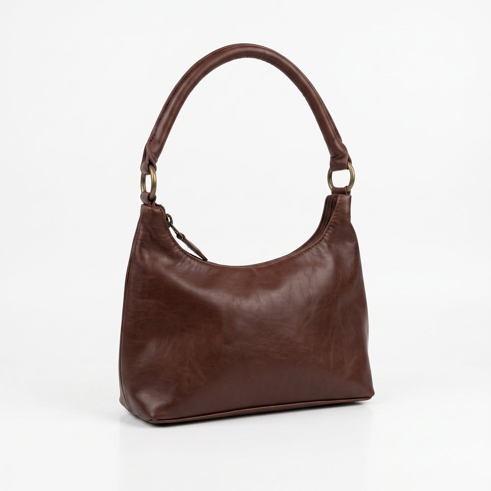 Brut & Beau brown genuine leather hobo handbag displayed on white background
